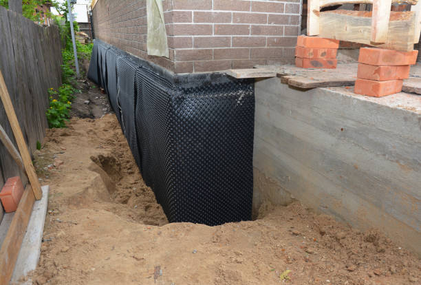 Happy homeowners after waterproofing job in Burns